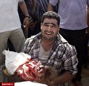 تصویری تکان دهنده از پیکر خونین کودک فلسطینی بر روی دستان پدر