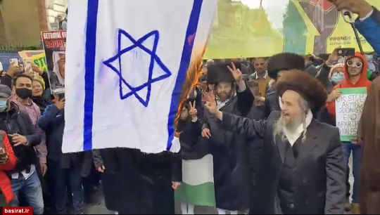 آتش زدن پرچم رژیم صهیونیستی در پایتخت انگلیس به دست خاخام های یهودی